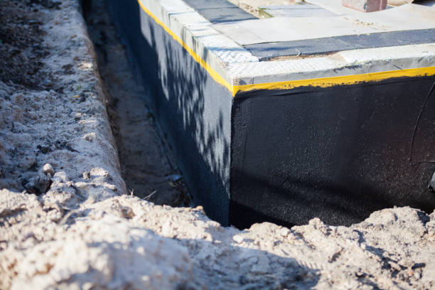 Professional Waterproofing technician working in Hempstead, NY